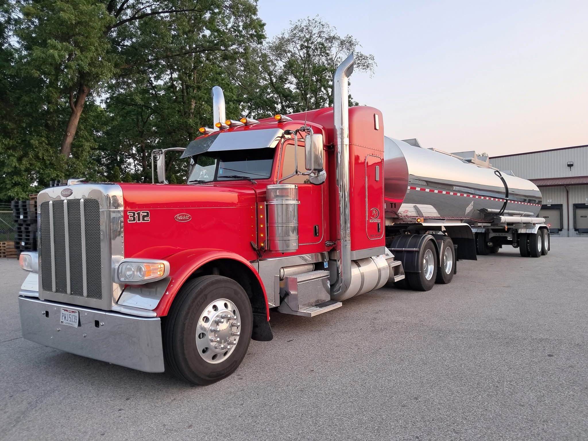 Unit 312 — a red Peterbilt hooked to a tanker trailer